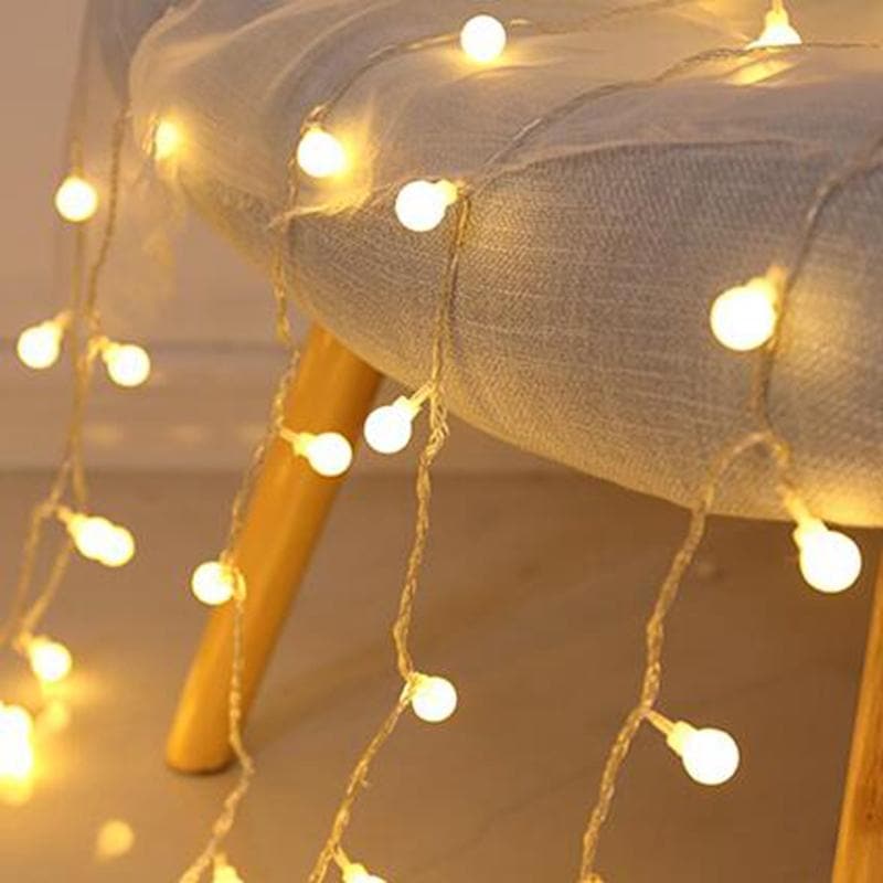 Fairy LED String Lights coiled with battery pack and plug, 33 ft, warm white, star and ball bulbs