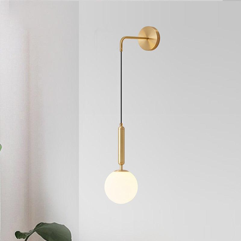 Poiret Series brass and black globe wall lamp with frosted 5.9-inch glass shade and adjustable rope cord