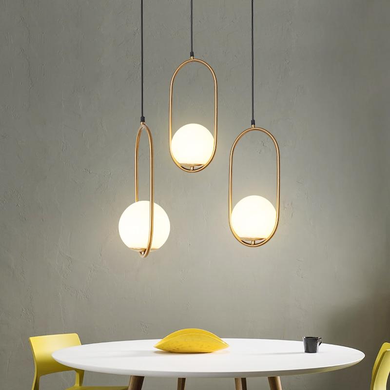 globe frosted glass shade brass loop suspended pendant light