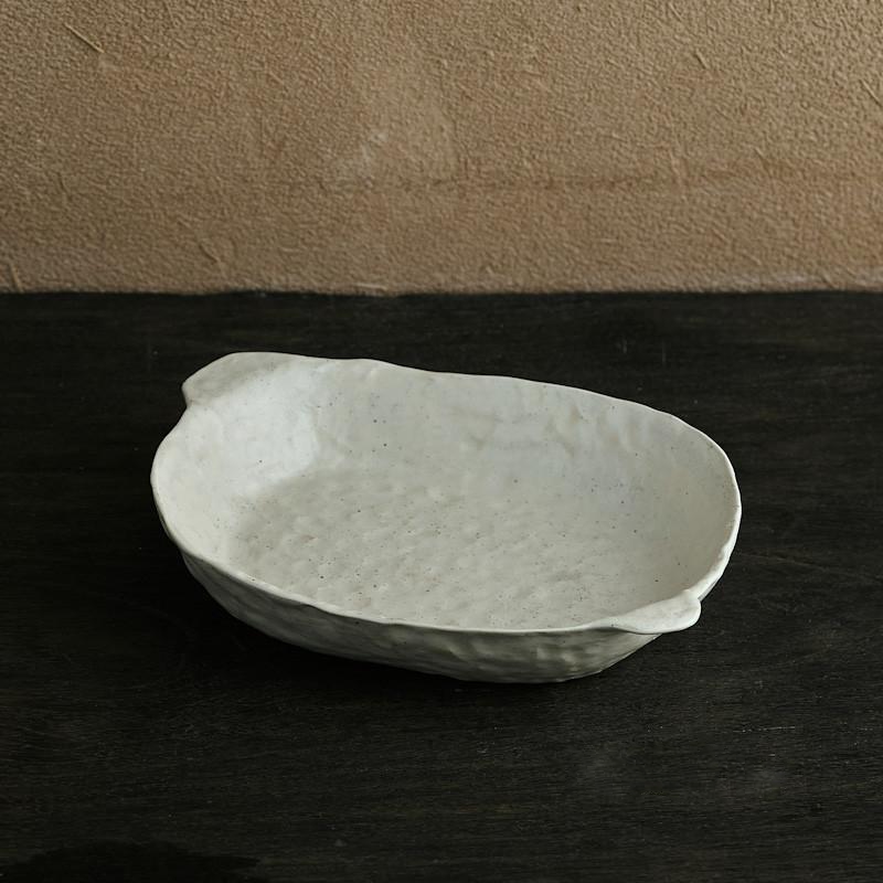 abstract round stone textured white ceramic plate