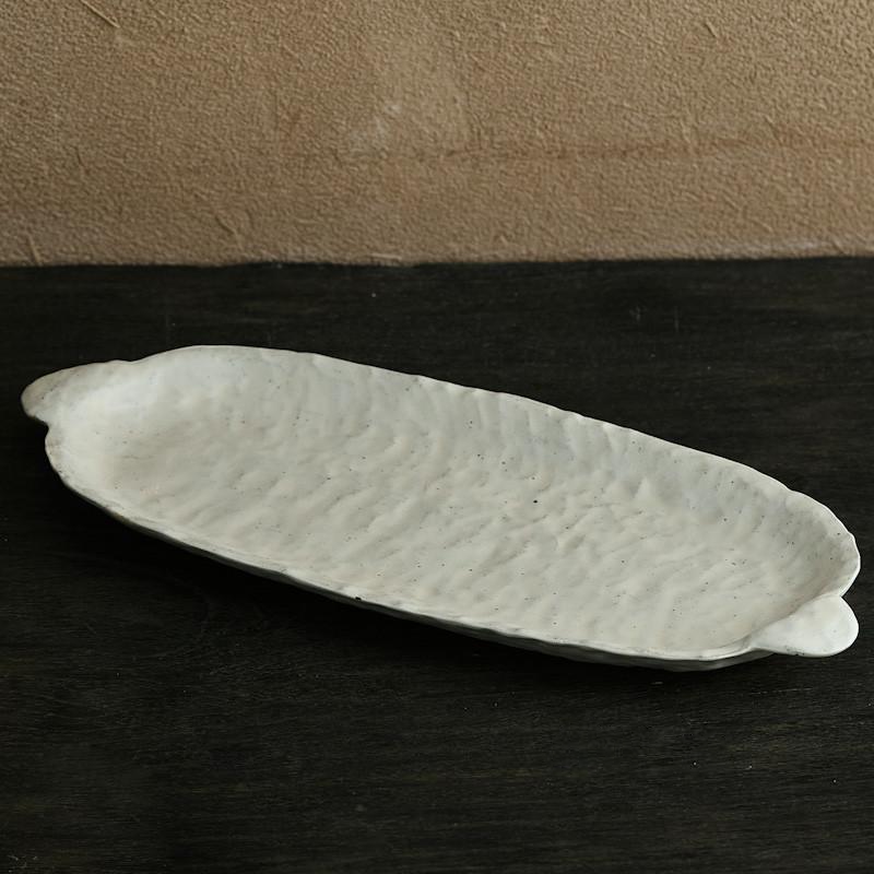 abstract round stone textured white ceramic plate