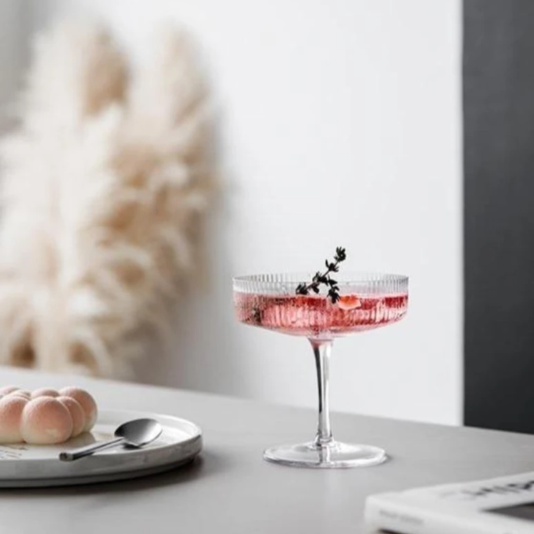 round textured champagne and cocktail glass
