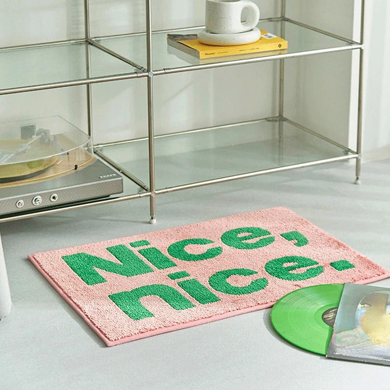 statement graphic tufted bath mat and runner rug in contrast colors