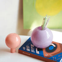 Pastel colored glass bud vase sealed lid sculptural aromatherapy flower diffuser container