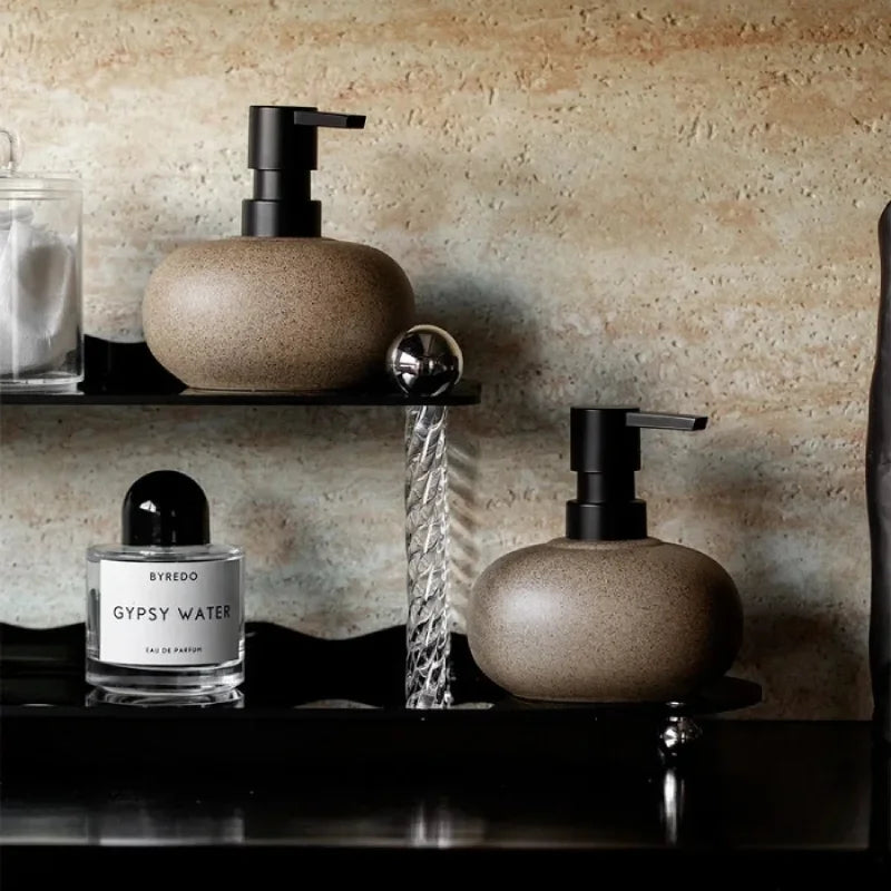 Ceramic pebble soap dispenser with matte black pump bathroom accessory