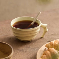 Ceramic ridged coffee mug warm brown textured tea cup sculptural handle minimalist drinkware