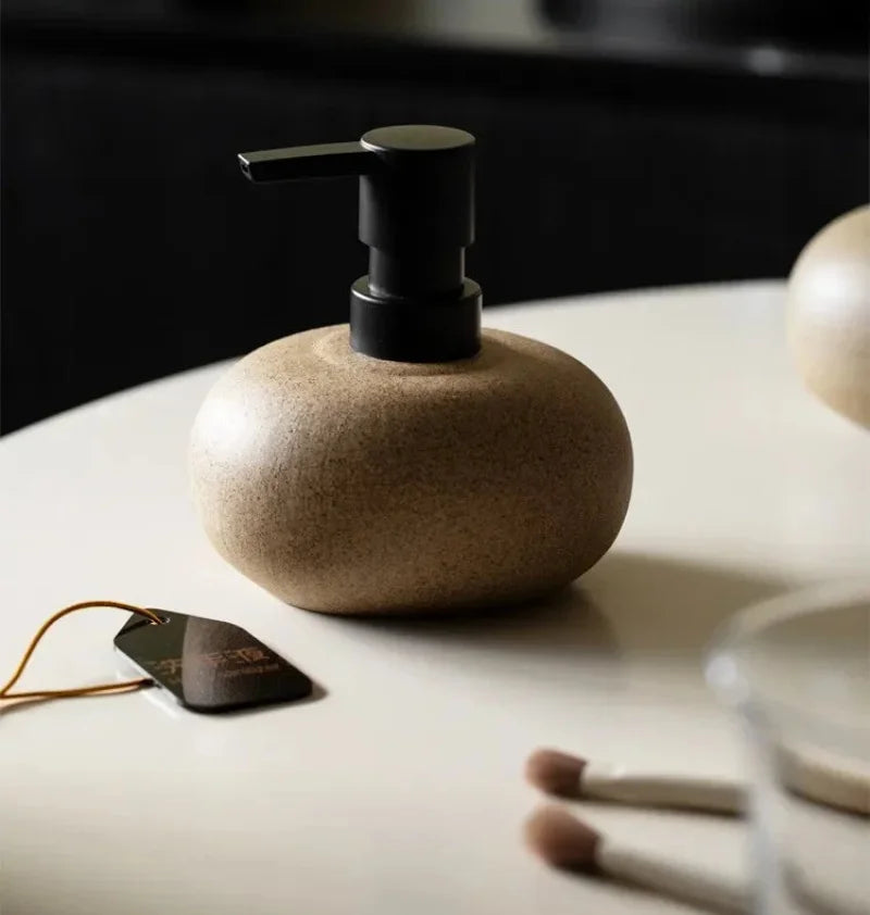 Ceramic pebble soap dispenser with matte black pump bathroom accessory