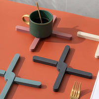 Foldable silicone heat resistant Crossfold Coaster Trivet, non-slip pot pan mat and coaster set in modern multi-color shades for kitchen table protection