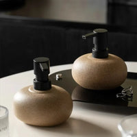 Ceramic pebble soap dispenser with matte black pump bathroom accessory