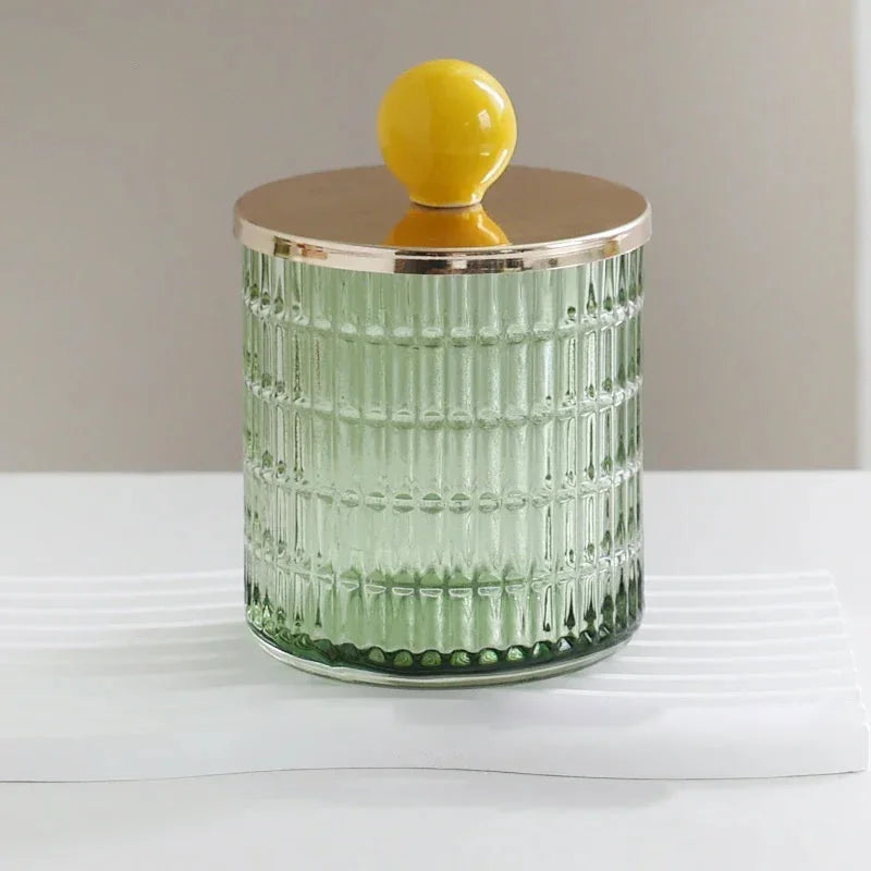Textured glass canister with colorful knob and metal lid storage jar