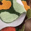Irregular green landscape tufted area rug with moss texture multicolor abstract design