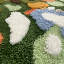 Irregular green landscape tufted area rug with moss texture multicolor abstract design