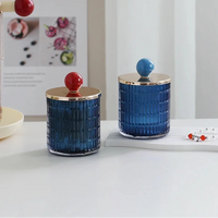 Textured glass canister with colorful knob and metal lid storage jar