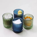 Textured glass canister with colorful knob and metal lid storage jar