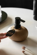 Ceramic pebble soap dispenser with matte black pump bathroom accessory
