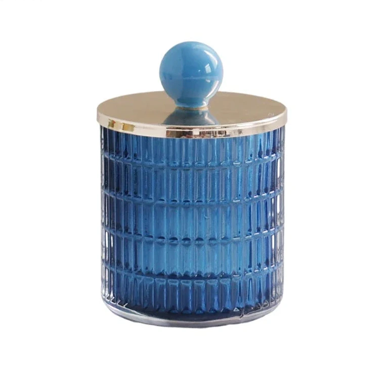 Textured glass canister with colorful knob and metal lid storage jar