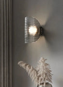 Modern ribbed glass wall lamp black finish ambient lighting half moon sconce contemporary interior