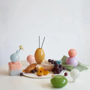 Pastel colored glass bud vase sealed lid sculptural aromatherapy flower diffuser container