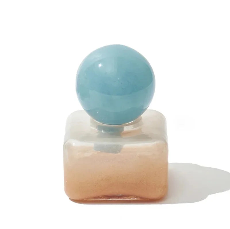 Pastel colored glass bud vase sealed lid sculptural aromatherapy flower diffuser container