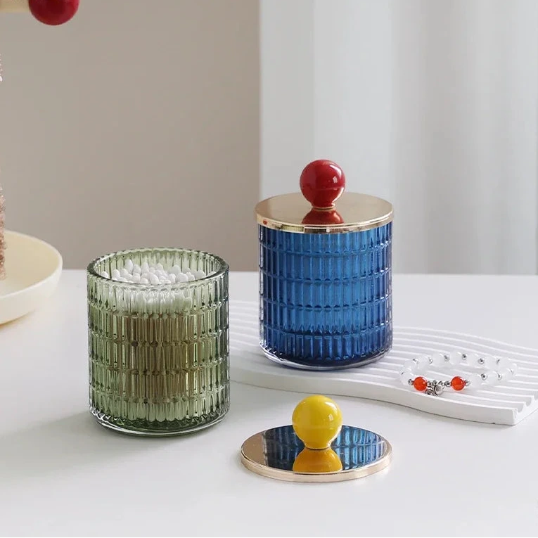 Textured glass canister with colorful knob and metal lid storage jar