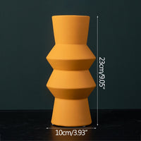 sculptured cylinder orange ceramic vase