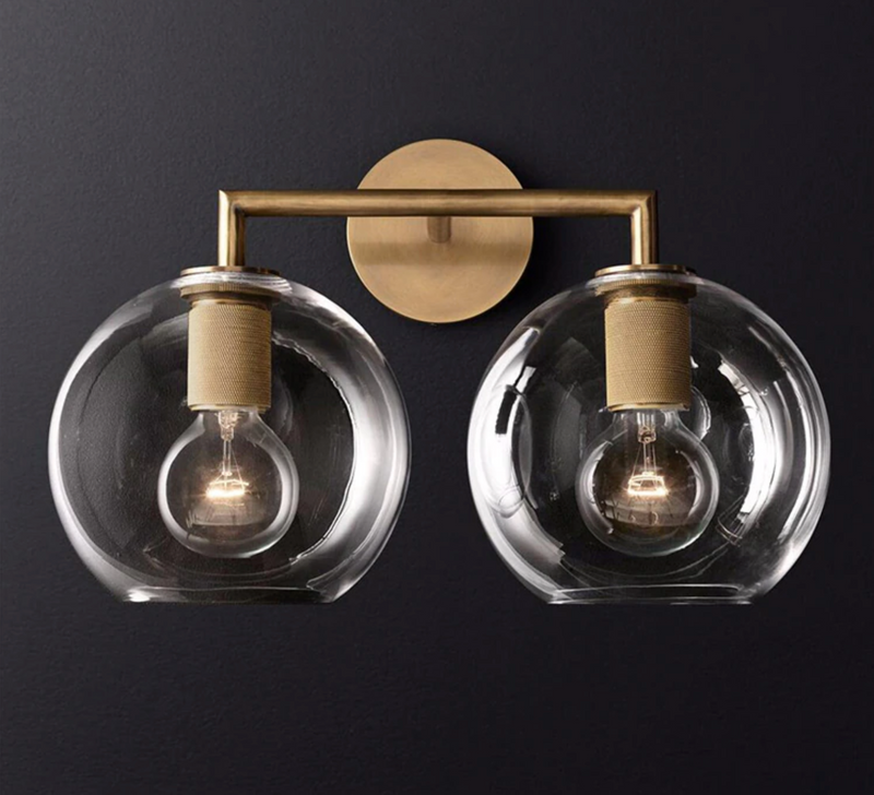 industrial Wall-mounted double sconce with brushed brass finish and glass shades
