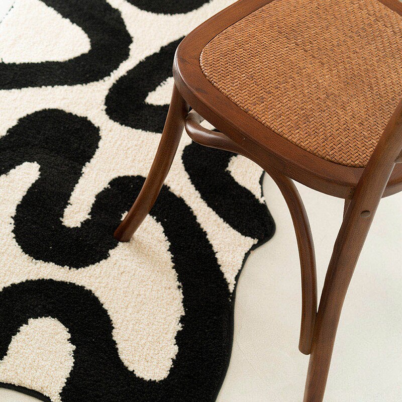 Black Swirl Shaped Area Rug