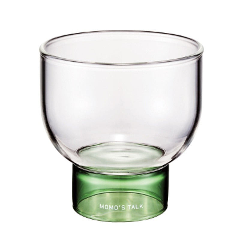 round clear glass cup with green base