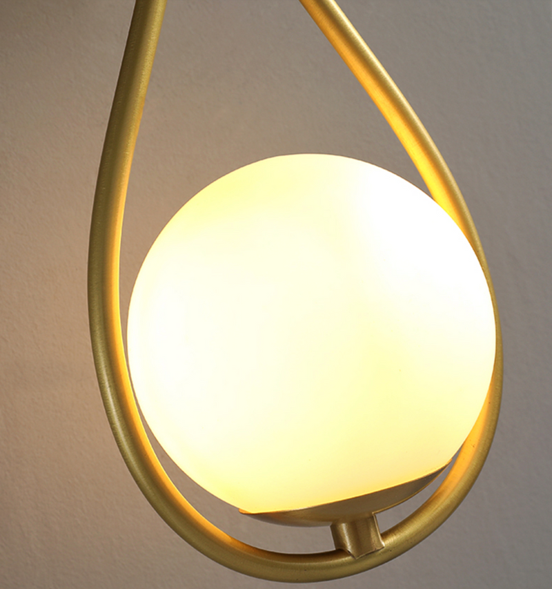 Loop Brass and Sphere Sconce
