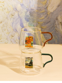 rounded clear glass van gogh-design mug with orange green handle