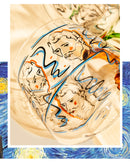 rounded clear glass van gogh-design mug with orange green handle