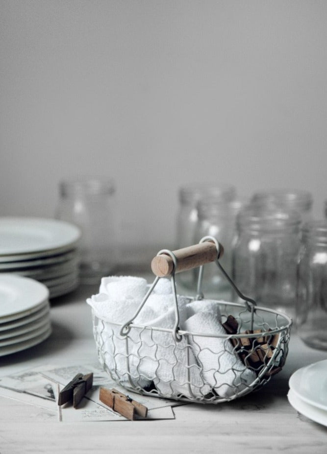 rectangle webbed wrought iron basket with wooden handle