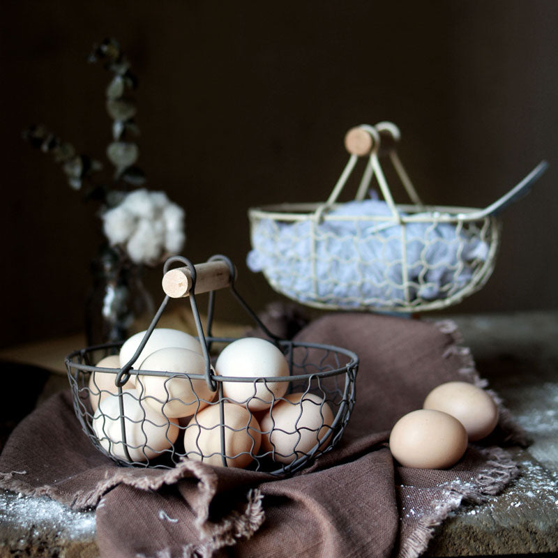 rectangle webbed wrought iron basket with wooden handle