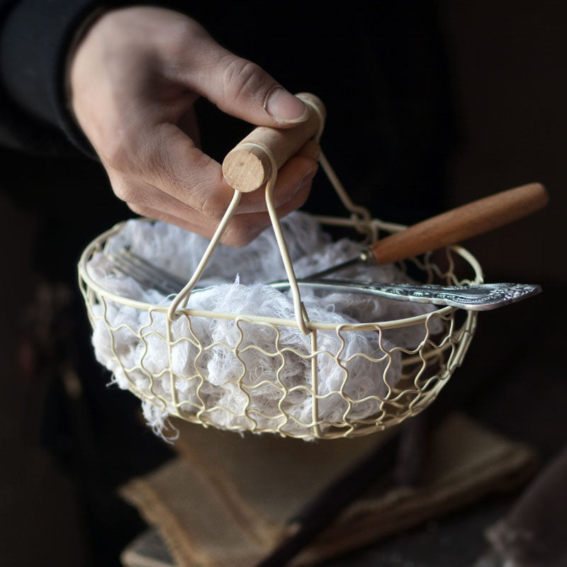 rectangle webbed wrought iron basket with wooden handle