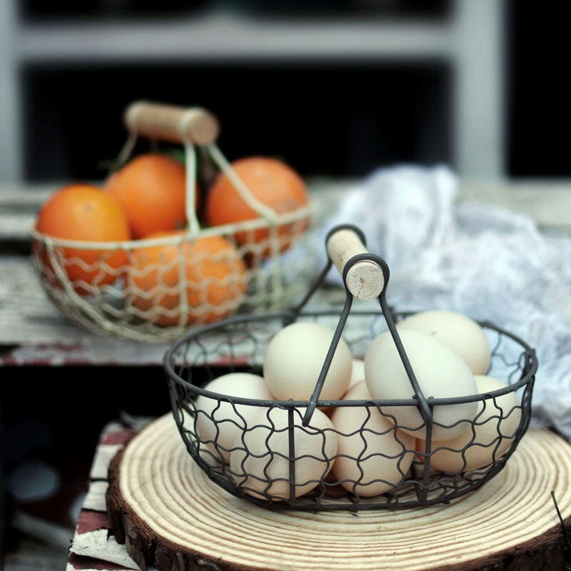 rectangle webbed wrought iron basket with wooden handle