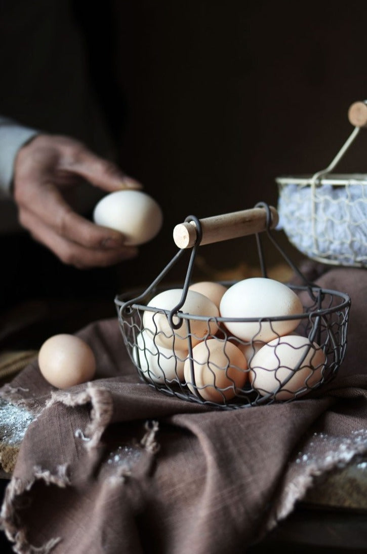 rectangle webbed wrought iron basket with wooden handle