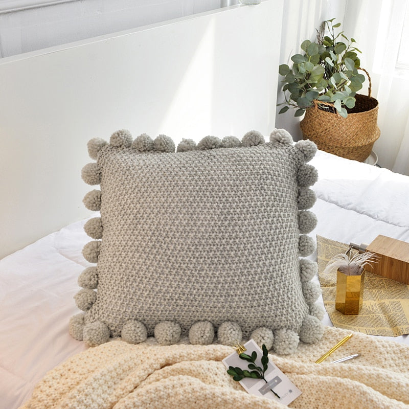 green cotton knitted cushion cover with pompom edges