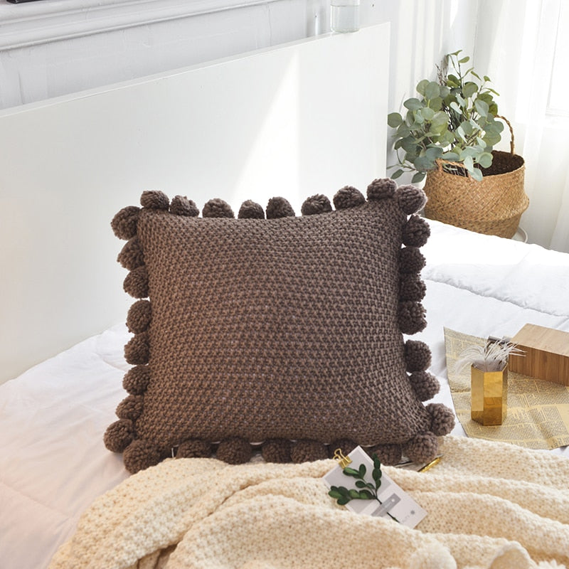 brown cotton knitted cushion cover with pompom edges