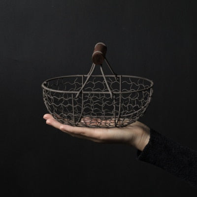 rectangle webbed wrought iron basket with wooden handle