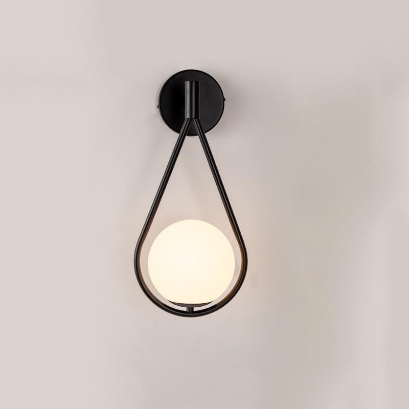 black loop shape wall lamp with a Frosted glass globe 