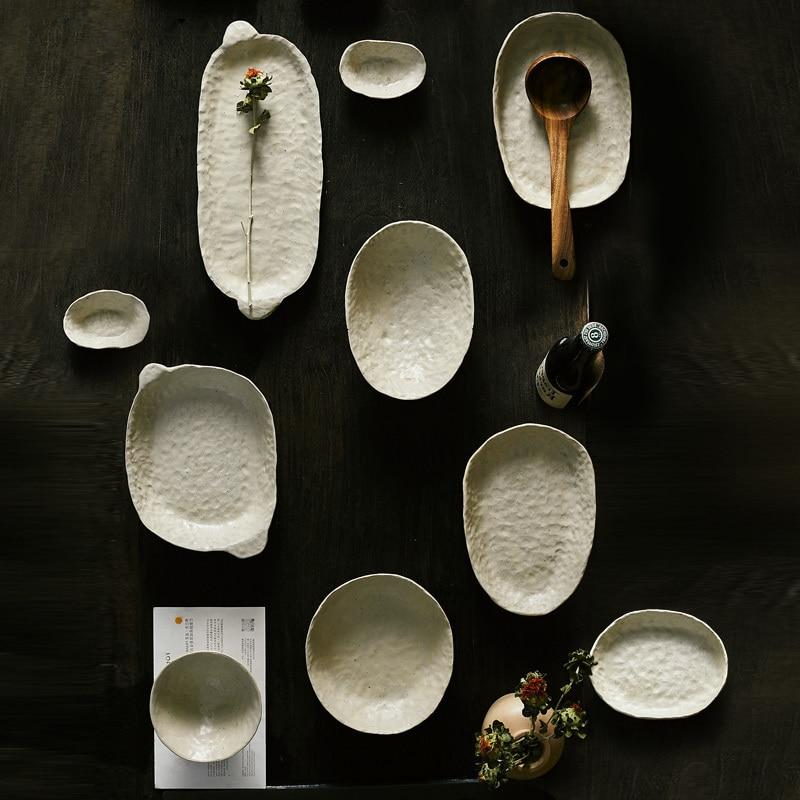 abstract round stone textured white ceramic bowls and plates