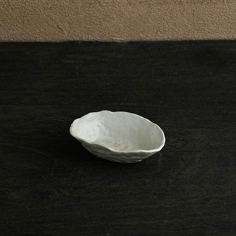 abstract round stone textured white ceramic bowl