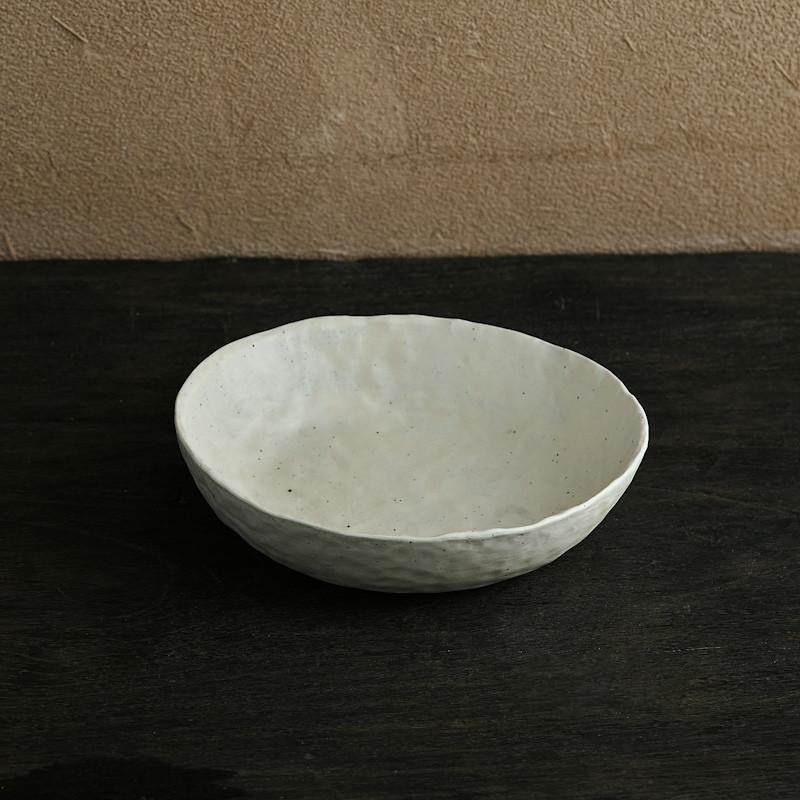 abstract round stone textured white ceramic bowl