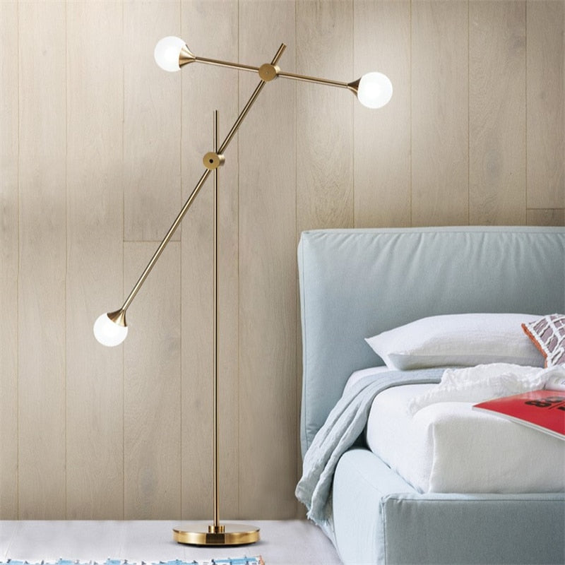 Three Bulb Dynamic Floor Lamp in Brass