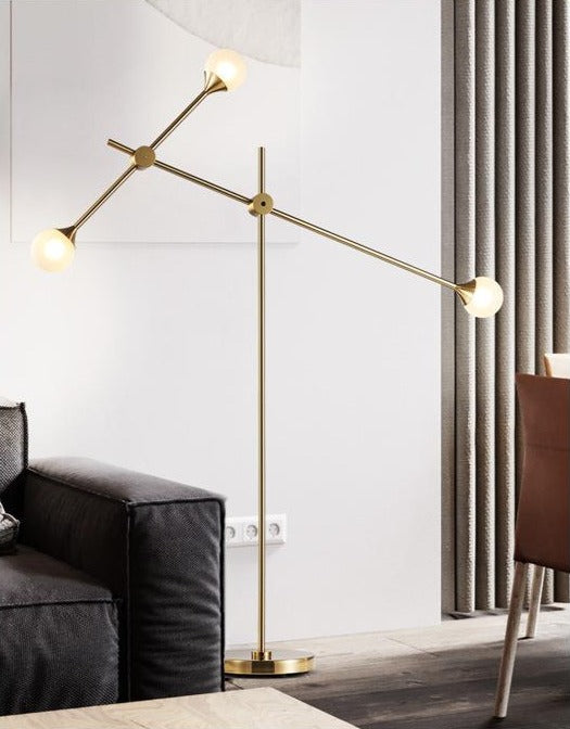 Three Bulb Dynamic Floor Lamp in Brass