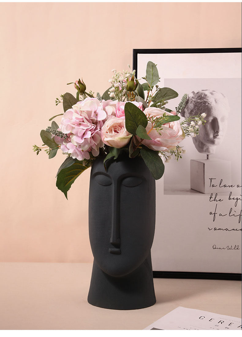 face handpainted porcelain and ceramic black vase