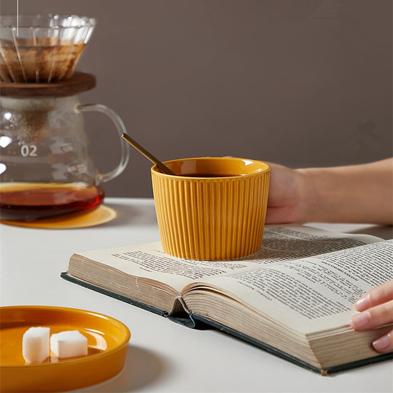 round textured stripe orange ceramic cup with matching saucer