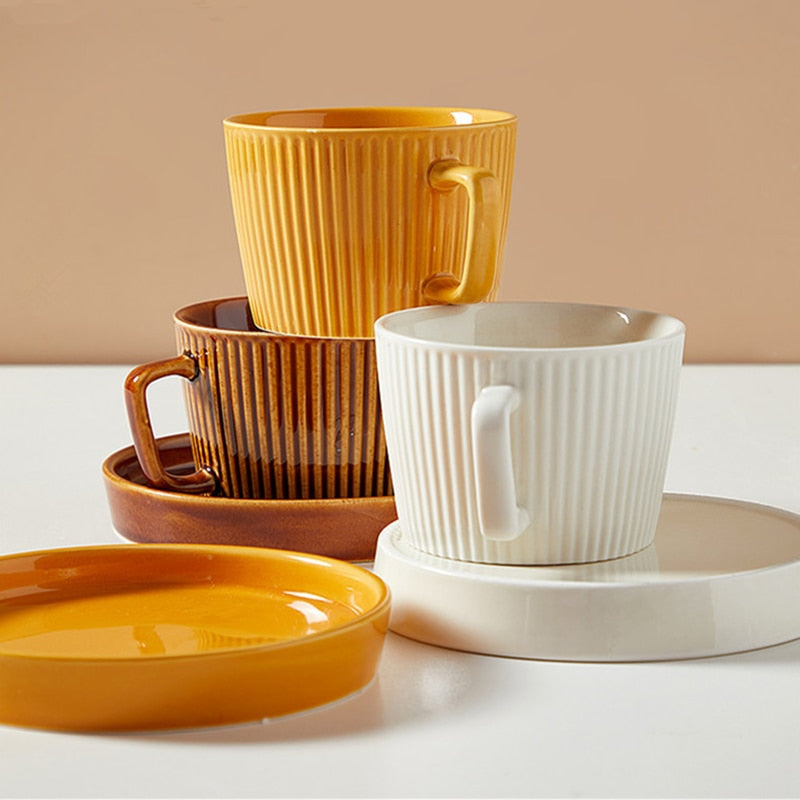 round textured stripe brown orange white ceramic cup with matching saucer