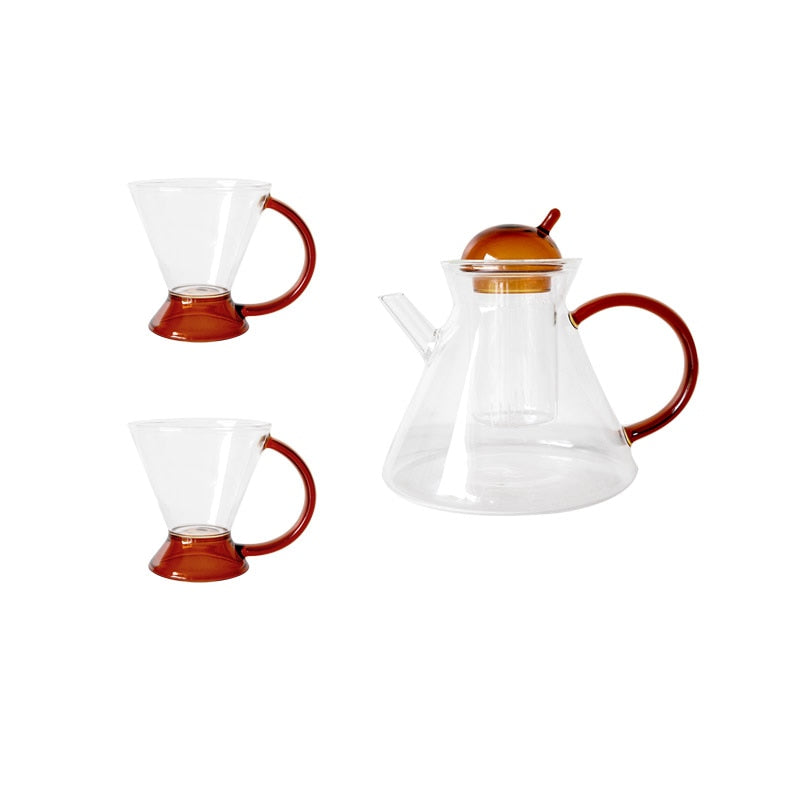 triangular clear borosilicate glass tea pot and cup with amber thin handle