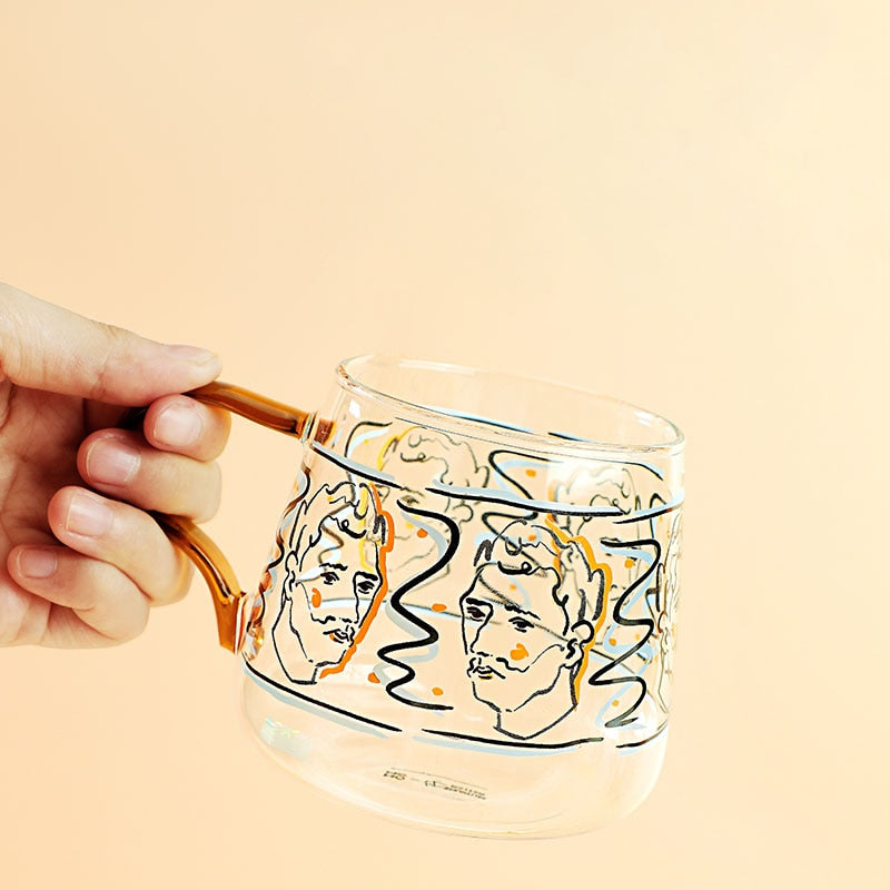 rounded clear glass van gogh-design mug with orange handle
